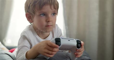 Young Child Engaged in Video Gaming Stock Video - Video of child, focus ...