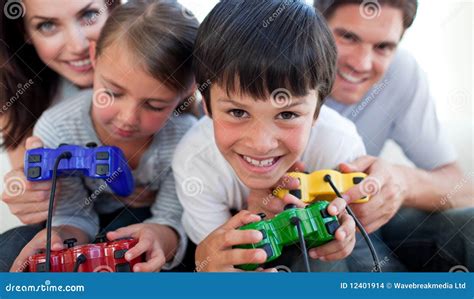 Parents Playing Video Games with Their Children Stock Photo - Image of ...