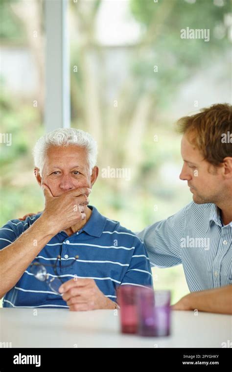 Sometimes a parent needs their child. a son comforting his senior ...