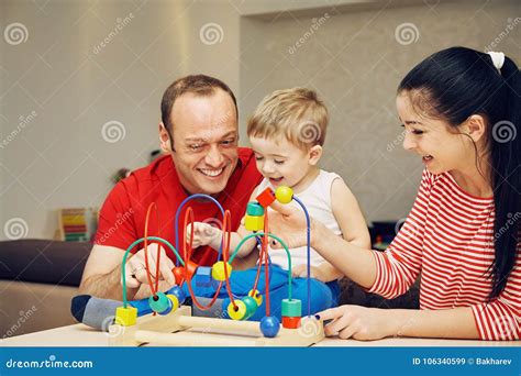 Parents Playing with Child in Developing Game Stock Image - Image of ...