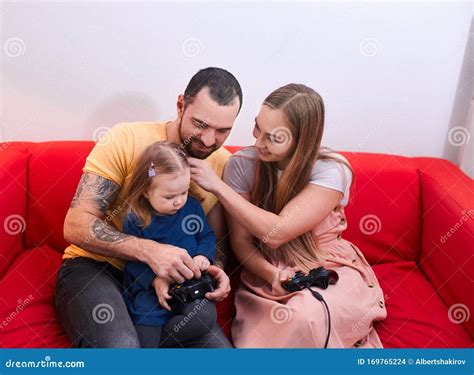 Young Family with Child Play Video Game Together Stock Photo - Image of ...