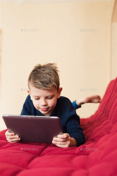 Child using tablet Stock Photo by shapoval08 | PhotoDune