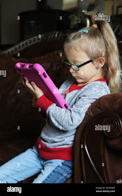 Child playing educational games on her tablet Stock Photo - Alamy