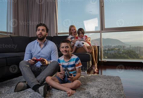 Happy family playing a video game 10779707 Stock Photo at Vecteezy