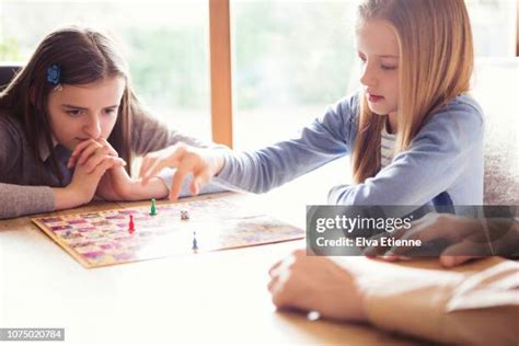 Family Playing Board Game Together Indoors High-Res Stock Photo - Getty ...