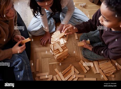 Children playing jenga at home Stock Photo - Alamy