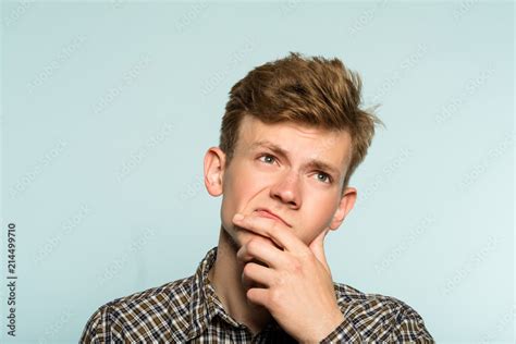 Stockfoto puzzled confused man scratching his chin thinking of smth ...