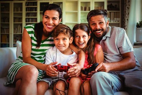Parents Playing Video Games with Children Stock Image - Image of ...