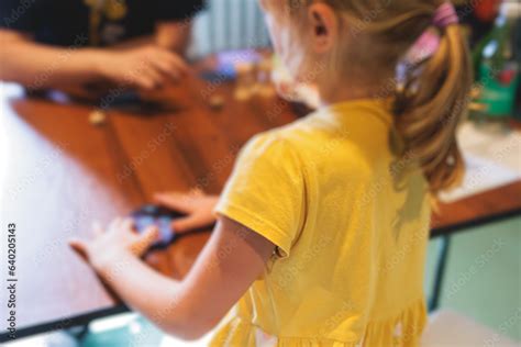 Process of playing board game and having fun with friends and family ...