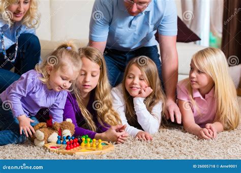 Family Playing Board Game At Home Royalty Free Stock Photos - Image ...