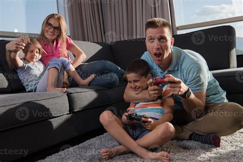 Happy family playing a video game 10798203 Stock Photo at Vecteezy