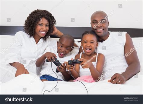 Happy Family Playing Video Games Together Stock Photo 204787861 ...