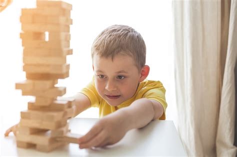 Premium Photo | Happy family playing board game together. home. cozy.