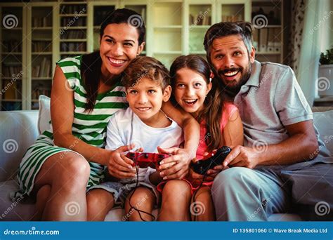 Parents Playing Video Games with Children Stock Photo - Image of ...