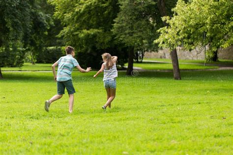 Group of Happy Kids or Friends Playing Outdoors Stock Photo - Image of ...