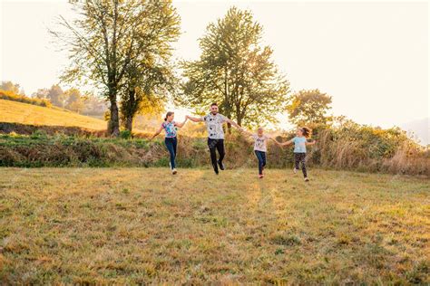 Premium Photo | Happy family playing together outside father and ...