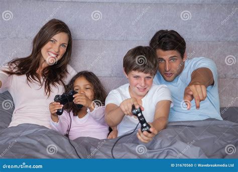 Happy Family Playing Video Games Stock Photo - Image of button, home ...
