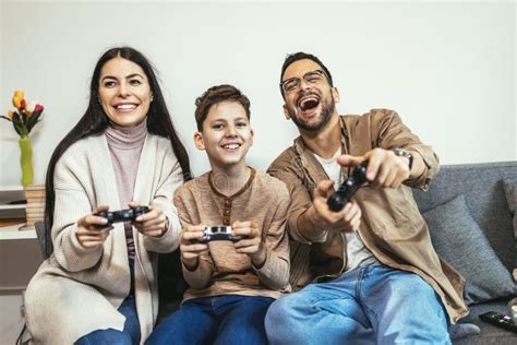 Family Playing Video Games at Home and Having Fun Together Stock Image ...