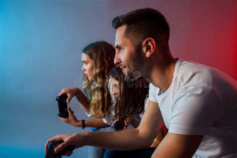 Happy Family Playing Video Games Together at Club Stock Photo - Image ...
