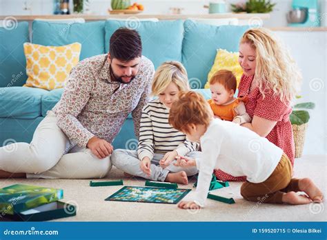Happy Family Playing Board Games Together at Home Stock Image - Image ...