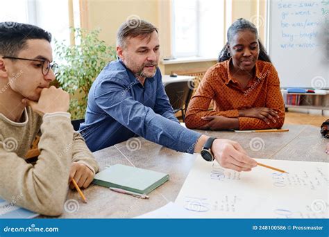 Teacher Explaining Something Stock Photo - Image of social, college ...