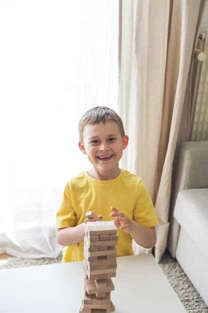 Premium Photo | Happy family playing board game together. home. cozy.