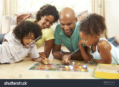Family Playing Board Game At Home Stock Photo 39878638 : Shutterstock