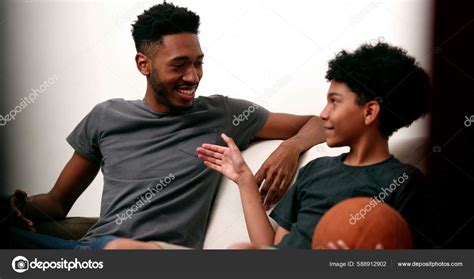 Older Brother Teaching Younger Sibling Spin Basketball Finger Two ...