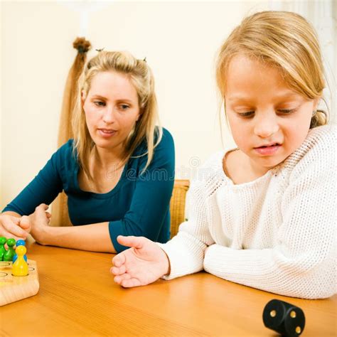 Family Playing a Board Game Together Stock Photo - Image of playing ...