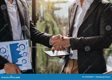 Business Handshake Closing a Deal with Blur Background of People Stock ...