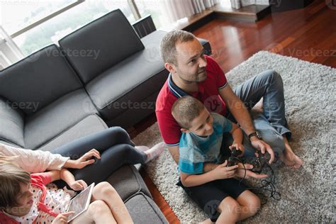 Happy family playing a video game 10800448 Stock Photo at Vecteezy