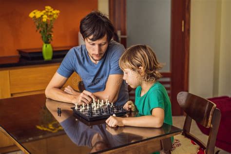 Happy Family Playing Board Game at Home Stock Photo - Image of family ...