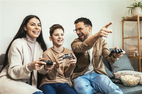 Family Playing Video Games at Home and Having Fun Together Stock Image ...