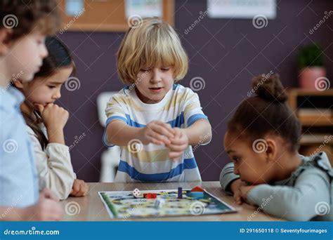 Diverse Group of Little Kids Playing Board Game Together in Preschool ...