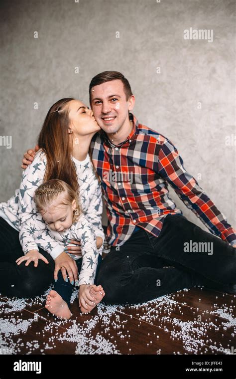 Happy family playing together on the floor Stock Photo - Alamy
