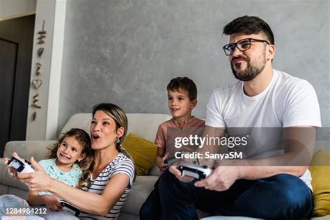 Family Playing Video Games High-Res Stock Photo - Getty Images