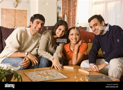 Multi-ethnic family playing board game Stock Photo - Alamy