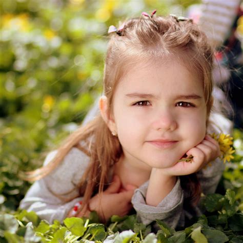 Download Girl Child On Grass Field Photoshoot Wallpaper | Wallpapers.com
