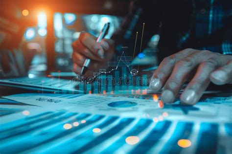 Business Team Analyzing Financial Charts and Graphs at a Desk with ...