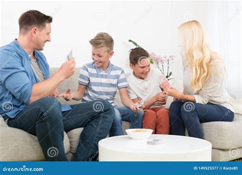 Happy Young Family Playing Card Game at Home. Stock Image - Image of ...
