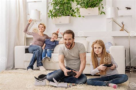 Parent and Child Playing Video Game Console Stock Image - Image of ...
