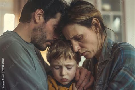 emotional family scene frustrated parents comforting crying child ...