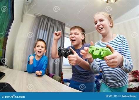 Children Playing On Games Console Stock Image - Image: 50112951