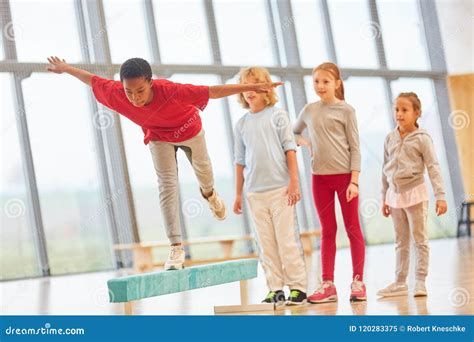 Children are Balancing on a Balance Beam Stock Image - Image of ...