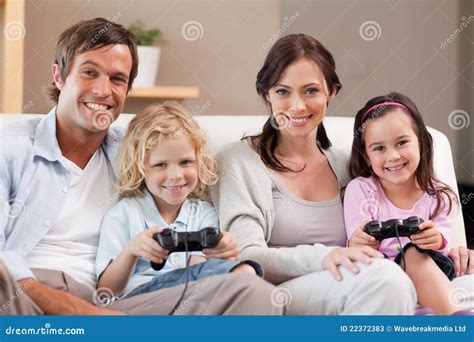 Smiling Family Playing Video Games Together Stock Image - Image of ...