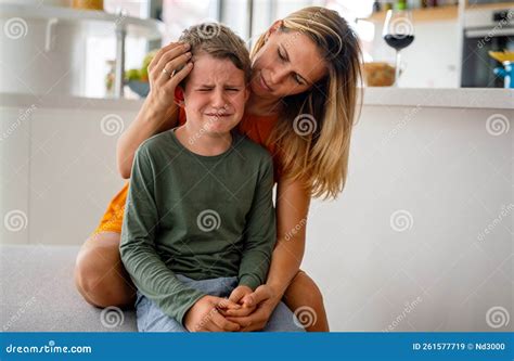 Portrait of Mother Consoling Her Crying Sad Injured Son. Child Family ...