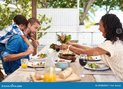 Always Make Time for Family. a Beautiful Young Family Enjoying ...
