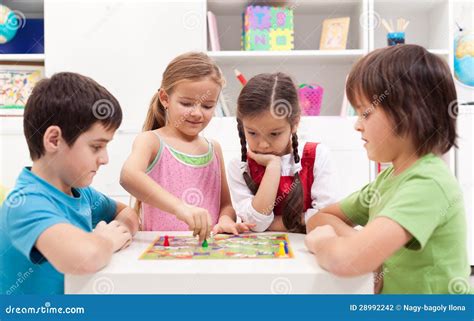 Children Playing Board Game Stock Photo - Image: 28992242