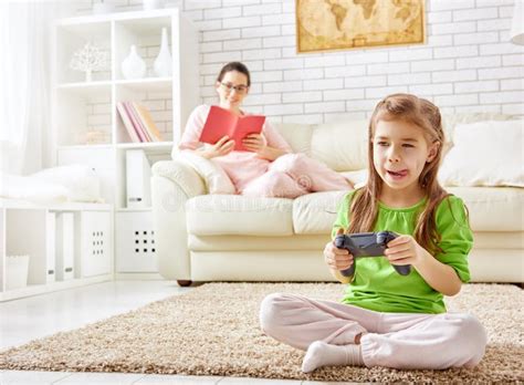 Child playing video games stock image. Image of concept - 63593477