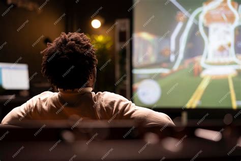 Free Photo | Gamer in front of smart TV watching science fiction ...